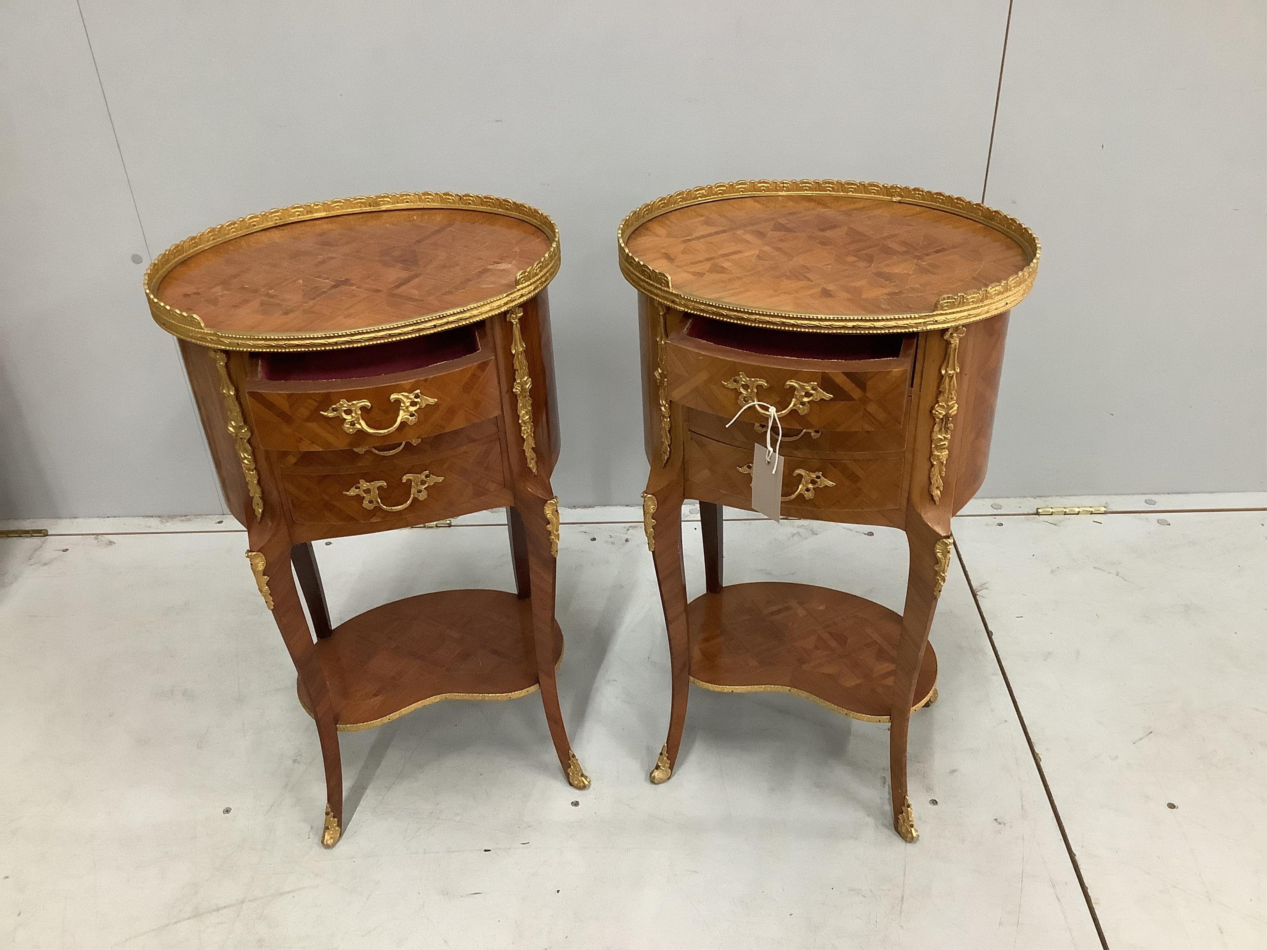 A pair of French transitional style gilt metal mounted kingwood oval three drawer bedside chests, width 40cm, depth 30cm, height 69cm